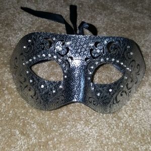 Never used silver and black unisex mask